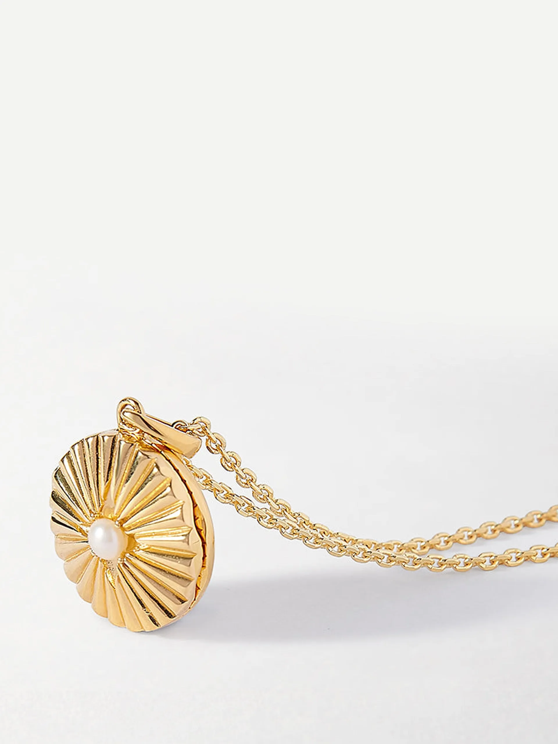 Gold radiant pearl locket necklace